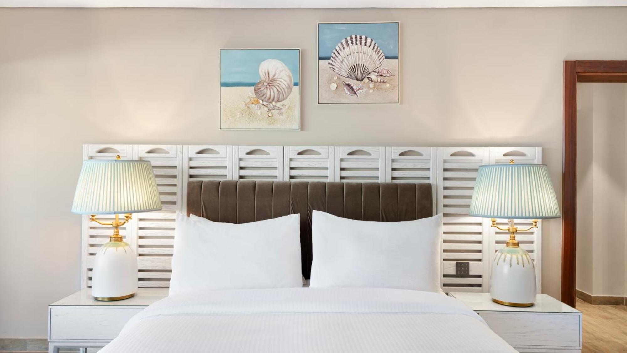 Rixos Premium Alamein El Alamein Quarto foto A bedroom at Hilton Garden Inn